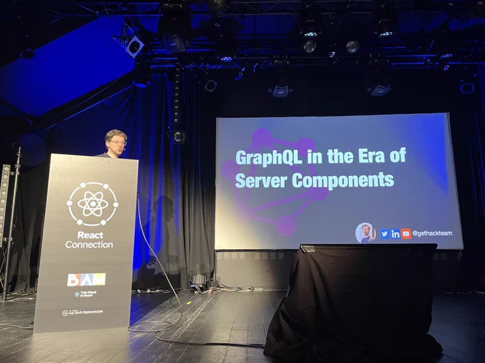 Roy Derks on stage of React Connection conference