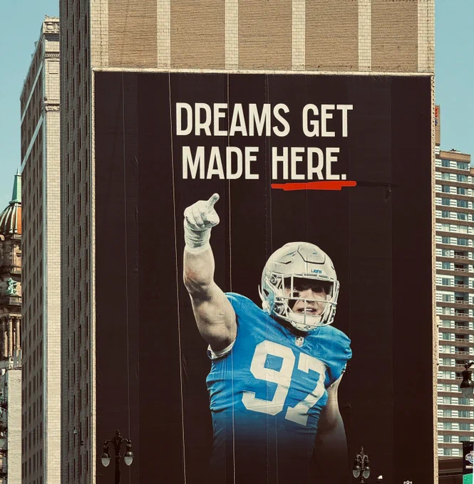 "Dreams Get Made Here" mural with Detroit Lion Aidan Hutchinson as seen from Woodward Avenue - photo by Pure Detroit