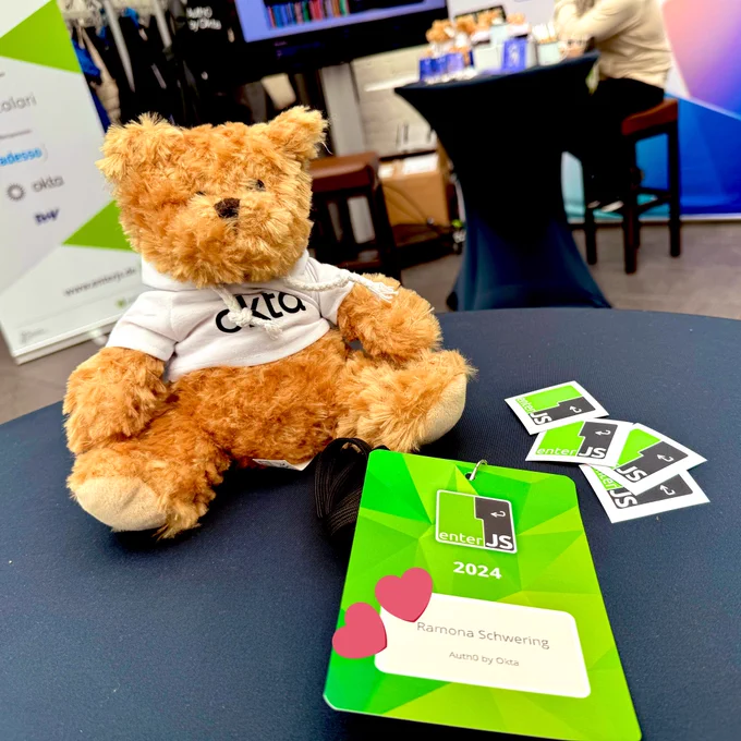 My speakers badge, alongside the cute Okta Teddybear