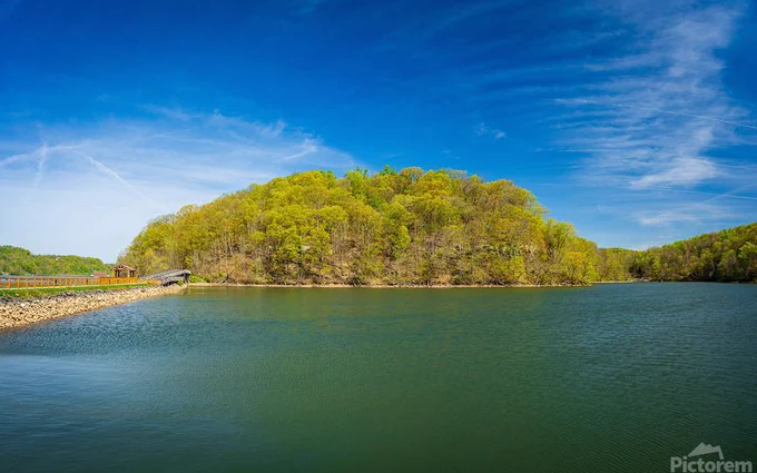 Warm light on the park at Cheat Lake near Morgantown West Virginia on a beautiful calm spring morning as the new leaves start to open on the trees