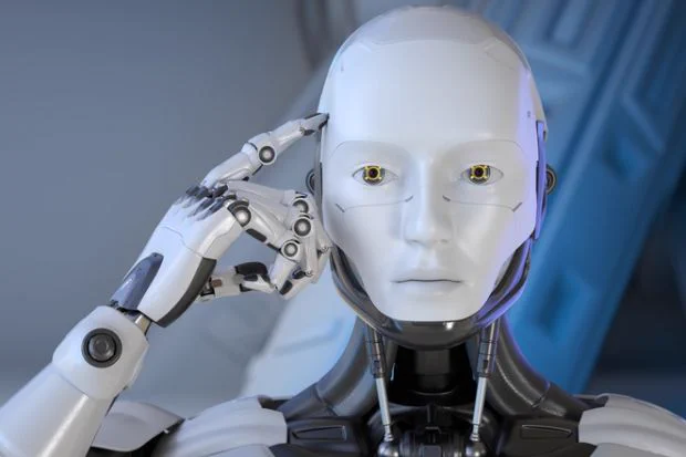 A robot points to its head
