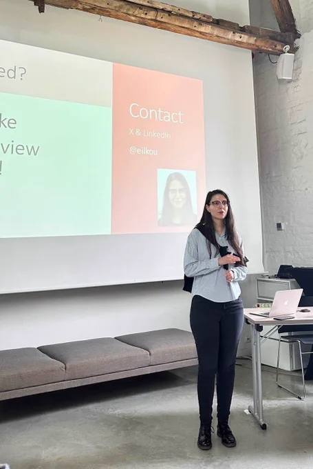 Photograph showing Eleni Ilkou presenting the "Solid Pods Vs Personal Knowledge Graphs: Similarities and Differences" in the 2nd Solid Symposium.
