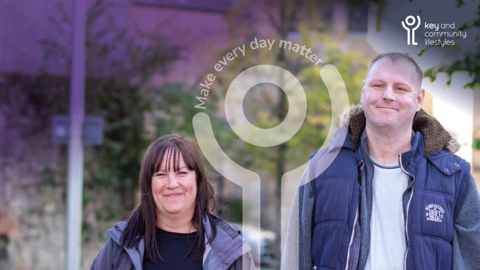 A woman and a man standing side by side. Behind them the scene is of soft focus trees and a building. The Key and Community Lifestyles logo is is in the top right of the image and in the centre is a logo icon holding the words "Make every day matter". 