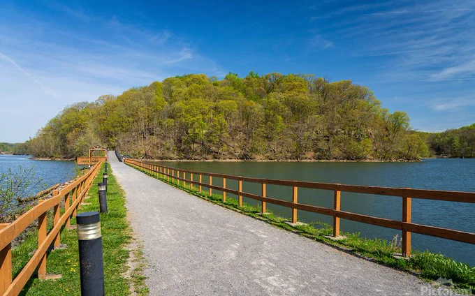 Warm light on the park at Cheat Lake near Morgantown West Virginia on a beautiful calm spring morning as the new leaves start to open on the trees