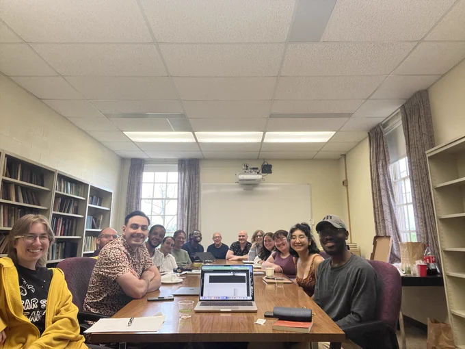 Pictured at this table from left to right: Reynie Zimmerman, Jeremy Daugherty, Matt Farley, Kyle Williams, Hossein Sobhani, Danton Remoto, Xavier Prince, Professor Keith Tuma, Ross Kohler, Maddie Portune, Sophia Judge, Hallie Fogarty, Priyadarshini Oshin Gogoi, and Adefemi Fagite. 