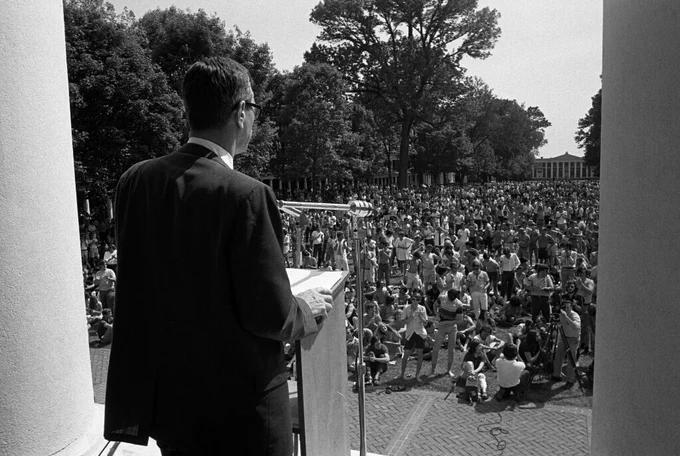 Black and white photograph of Edgar Shannon at the Rotunda addressing a large crowd of UVA students on the Lawn. May 10, 1970 (RG-5/7/2.762)