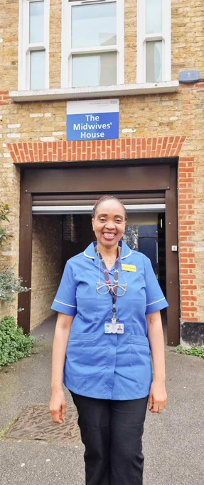 Image of Hanat Salau, standing in front of The Midwives' House marking International Day of the Midwife.