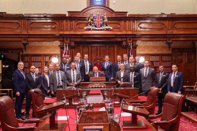Photo in the Legislative Council of NSW of RCDS students stood with Deputy President and MLC
