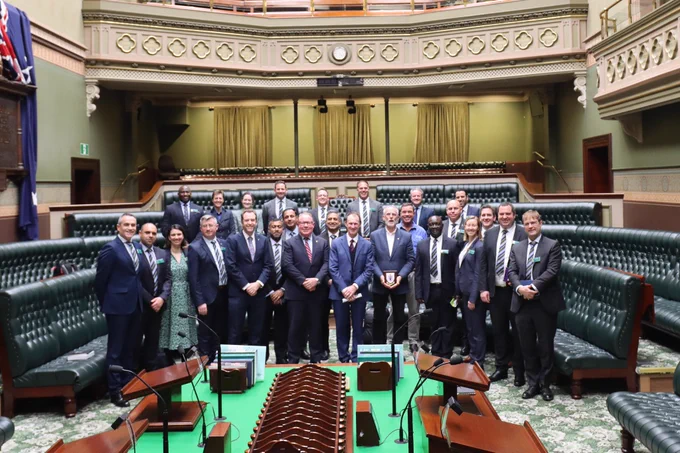 Photo in NSW Legislative Assembly of RCDS students with speaker and MLAs.