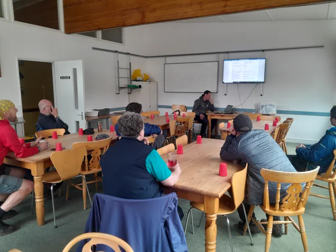 Photo of instructors sat in a training session.