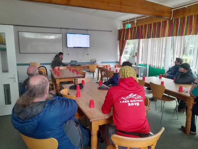 Photo of instructors sat in a training session.