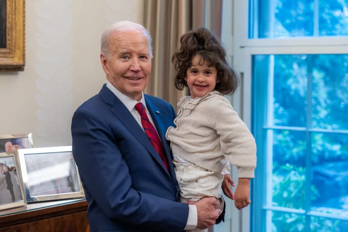 President Biden holds Abigail in the Oval Office.