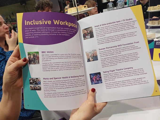 The inside of the programme for the event highlighting the nominations in the inclusive workplace category, including Taking Flight