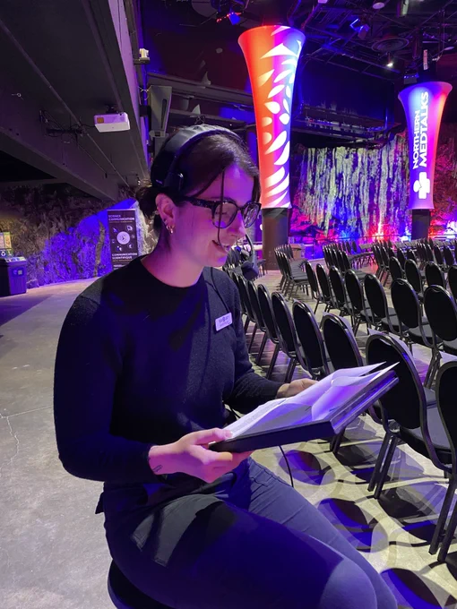 A science communication student reading the off-screen narration. 