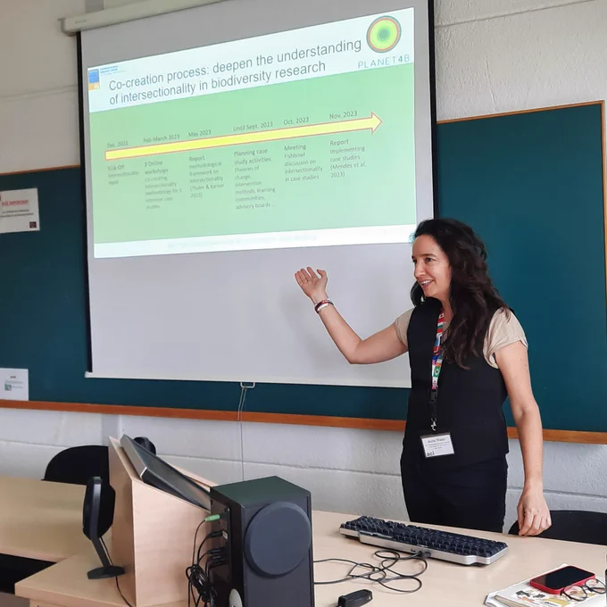 Anita presenting slides.