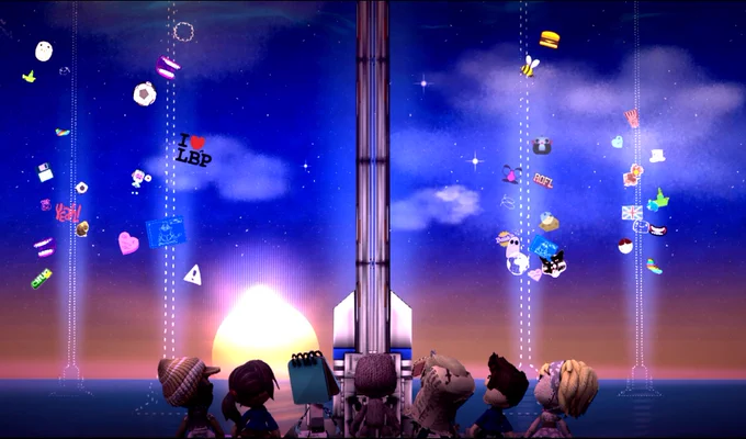 Sackboy and friends look out across the sea at sunset at a space elevator. It's flanked on either side by two pairs of outlined space elevators, suggesting that more towers could be built in the future. Stickers flow up each tower like a cerebrum bilical cord