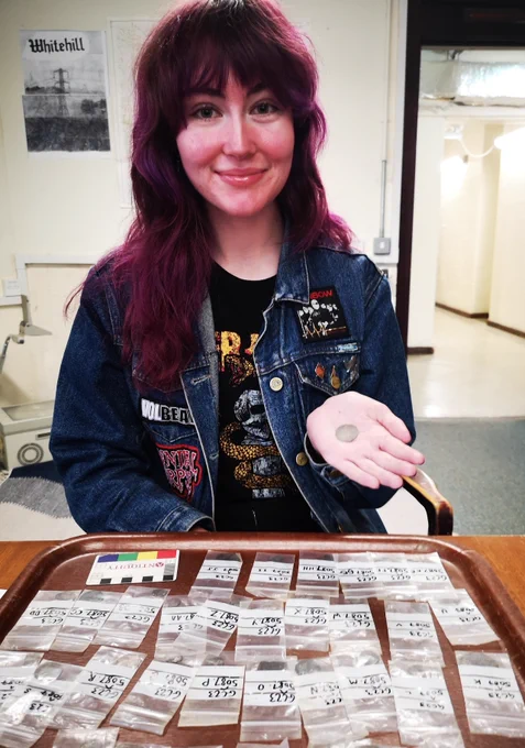 Lucy Ankers, an undergraduate archaeology student at the University of Glasgow, discovered the hoard while excavating the hearth of the Summerhouse structure. 