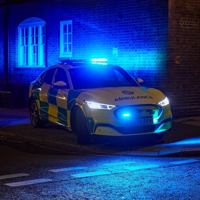 Image shows a fast-response car on blue lights at night in London.