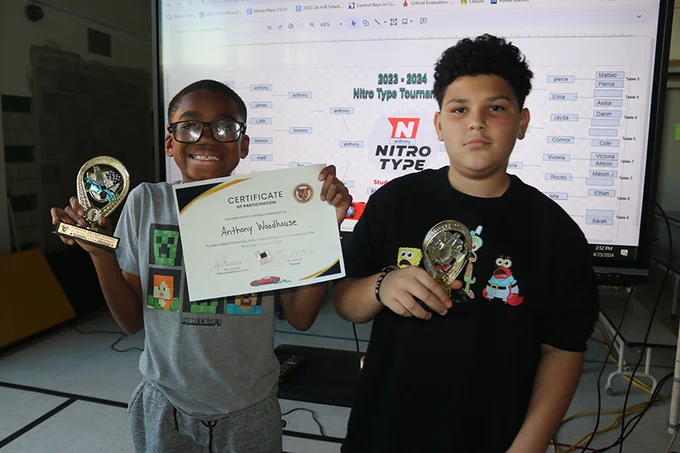 Left: Anthony Woodhouse, typing champ; and Isaac Dasilva (right) runner up.