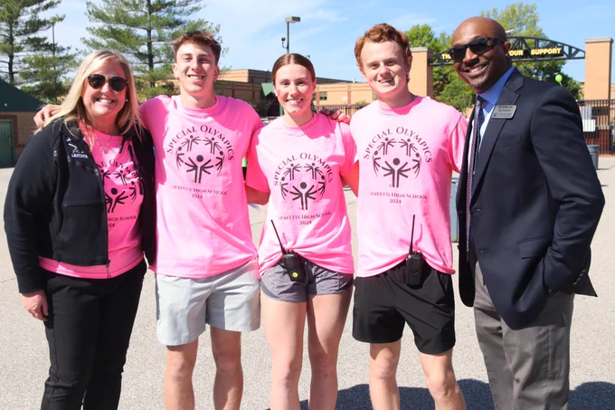Rockwood students, their school principal and Superintendent Dr. Curtis Cain smile at the Special Olympics track and field event at a Rockwood school.