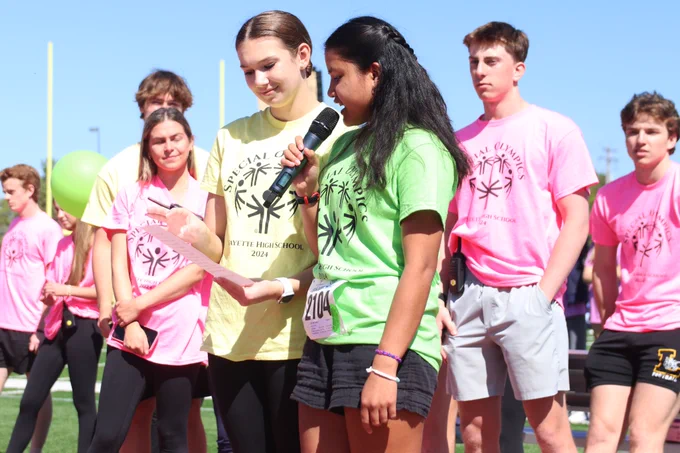 A Rockwood student makes a presentation to the crowd at the Special Olympics track and field event at her school.