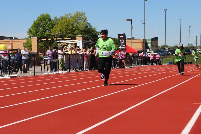 Students participate in a race on the track at the Special Olympics track and field event at a Rockwood school.
