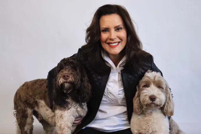 Governor Gretchen Whitmer with her two dogs, Kevin and Doug.