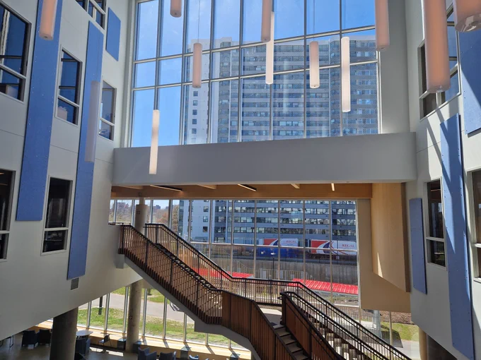 Atrium with large glass window and stairs