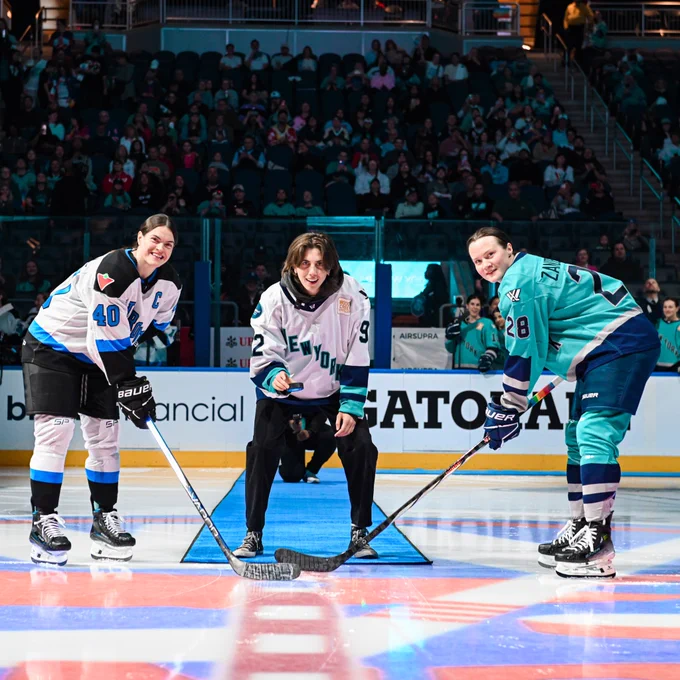 E.R. Fightmaster dropping a puck.