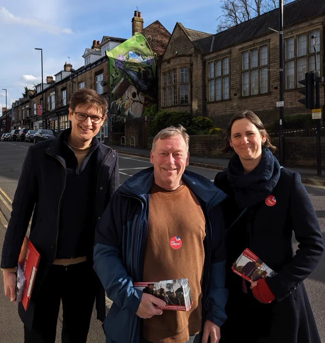 A photo of Tom Hunt, John Wright and Laura McClean standing outside Walkley Library in Walkley.