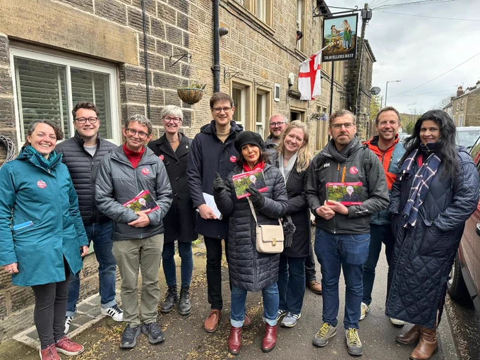 A photo of eleven Labour Party campaigners in Oughtibridge.