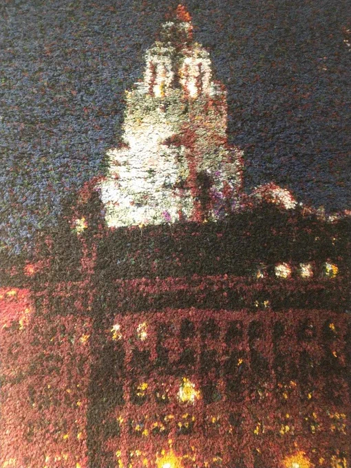 Detail of part of the Liverpool waterfront rag rug depicting the Liver Building lit up at night.