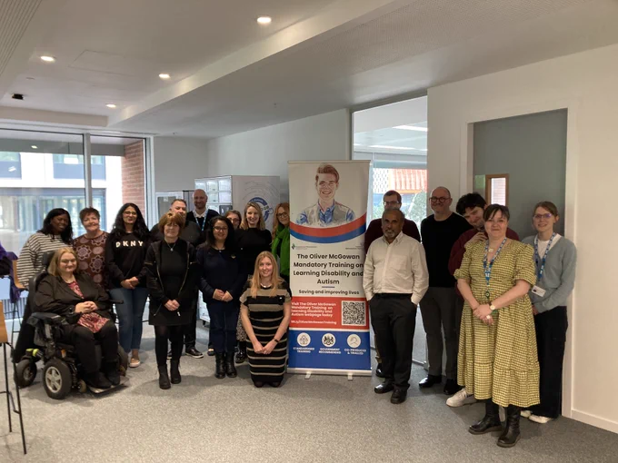 Group photo of NHS Midlands - Learning Disability, Autism and SEND team with the Oliver McGowan Mandatory Training Trainers