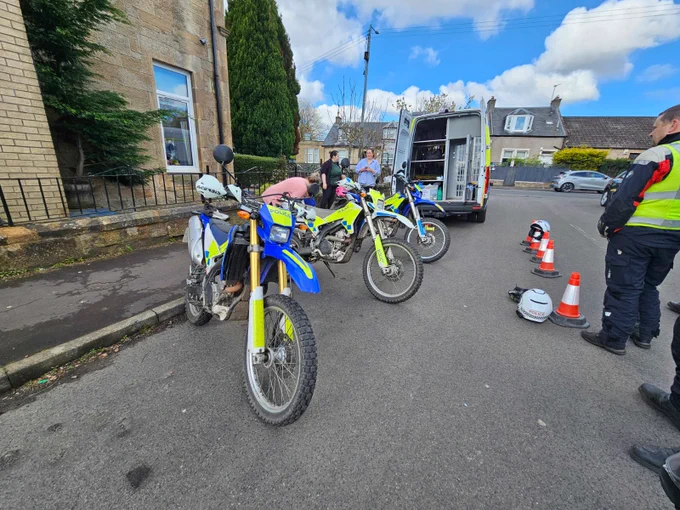 3 parked police motorbikes outside nursery