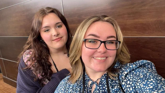 Clara Monson (front) takes a selfie with Taylor Beam at the Sigma Tau Delta convention.