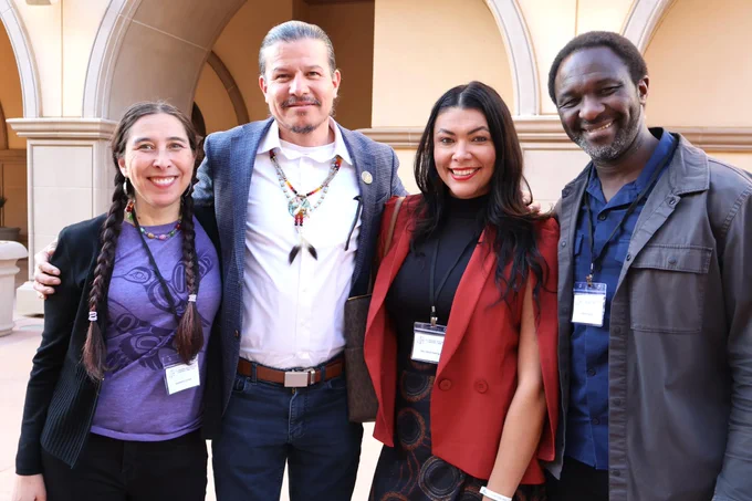 Stephanie Russo Carroll, Councilman Sammy Matsaw Jr. of the Shoshone-Bannock Tribes, Desi Small-Rodriguez and Ibrahim Garba pose during the opening night mixer.