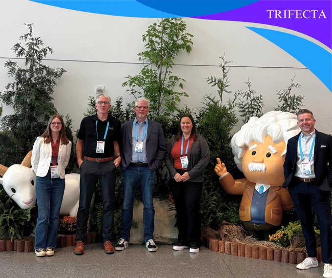 five people in front of a woods display and Salesforce characters