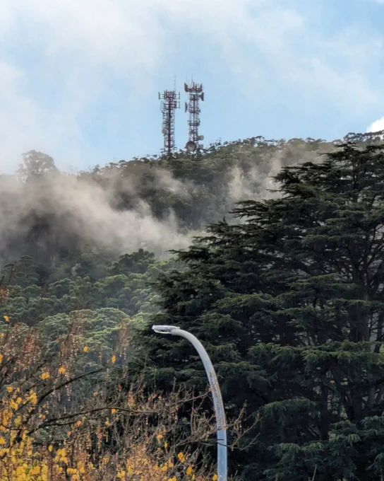 Radio masts on Mount Gibraltar, partially shrouded in mist 