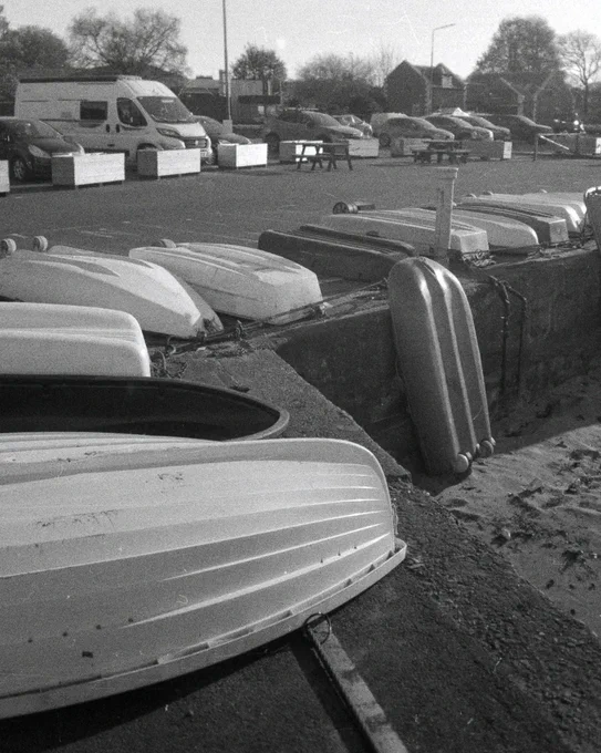 Black and white photograph of small boats at Fisherrow Harbour