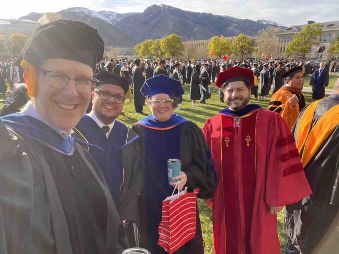 Faculty dressed up in academic regalia as named in the post.