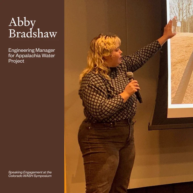 Photo of Abby speaking into a microphone. Brown background. Text: Abby Bradshaw, Engineering Manager for Appalachia Water Project, Speaking Engagement at the Colorado WASH Symposium