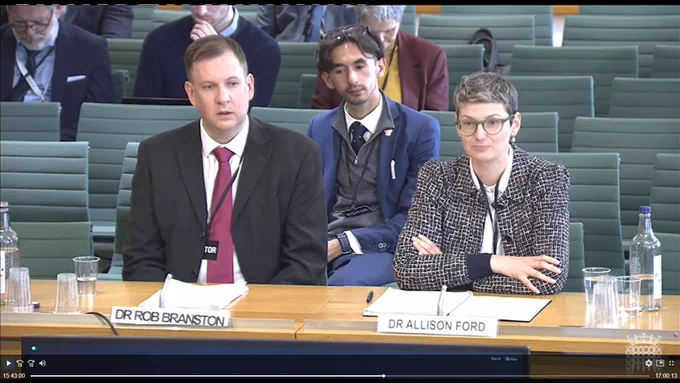 Image is a screenshot of an oral evidence session from the UK Parliament Tobacco and Vapes Bill. This image shows Dr. Allison Ford from the University of Stirling and Dr. Rob Branston from the University of Bath. The full session can be seen here: https://parliamentlive.tv/event/index/a96d9729-d3ae-4c8b-a8ca-3ae25a681595