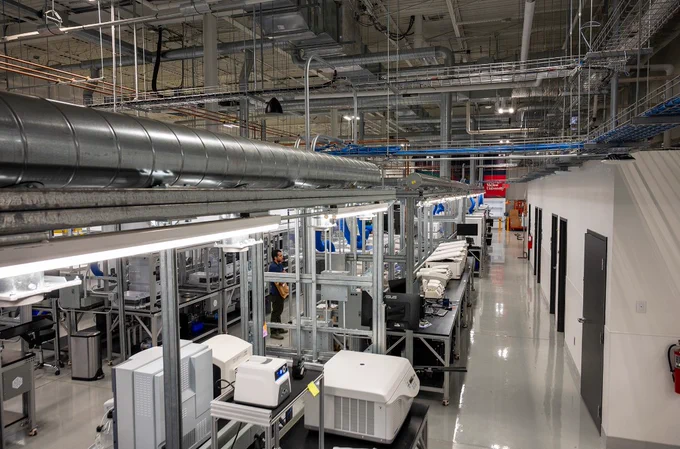 A photo of a scientific laboratory taken from above looking down on the pipes and equipment. 