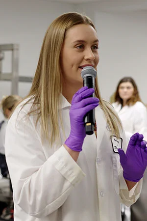 Chandler gives instructions to first-year students in the anatomy lab.