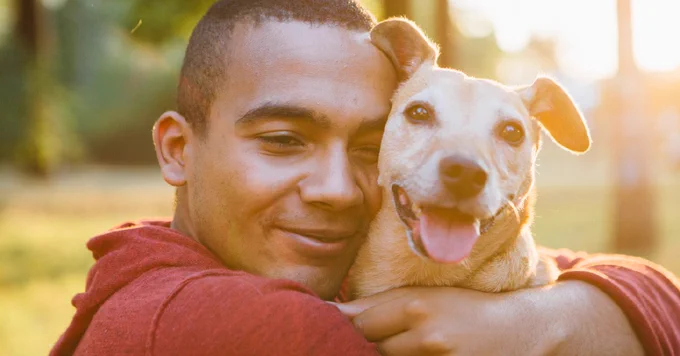 Man hugging his dog