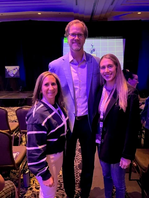 Chris Pronger posing for a photo between two Ophea Safety Injury and Prevention Advisory Committee members at the International Concussion Summit. Chris Pronger, a former pro-athlete was a featured speaker at the International Concussion Summit and shared his personal experience with concussions.