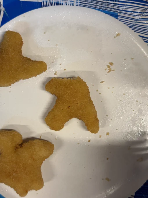 Dino chicken nugget in the shape of the Aphex Twin logo