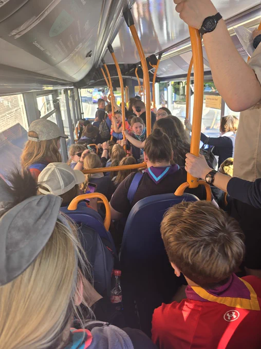 Lots of Scouts and Guides on a bus on their way back to County Hall