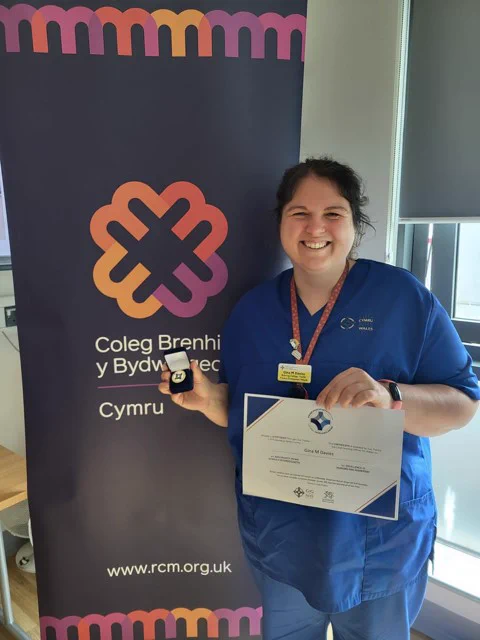 Gina Davies and her award.