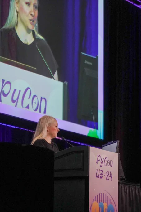 Me (Lynn Root) on stage giving my lightning talk (photo taken by @psobot)